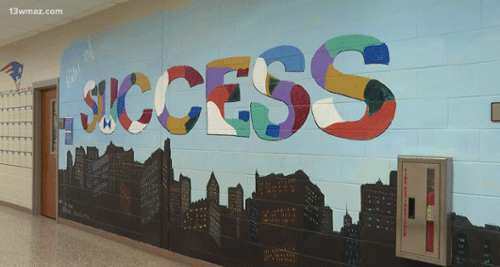 Mural that reads "success". 